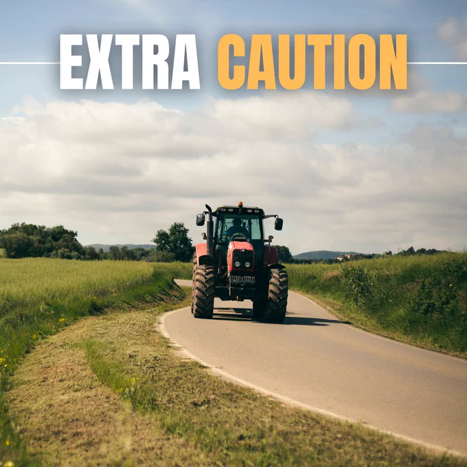 Image of a farm tractor driving on road.

Text reads Extra Caution.