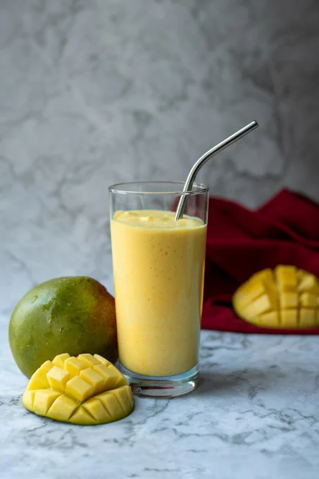 Photo of mangos and a shake. 