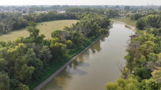 The Red River of the North flows through farmland.