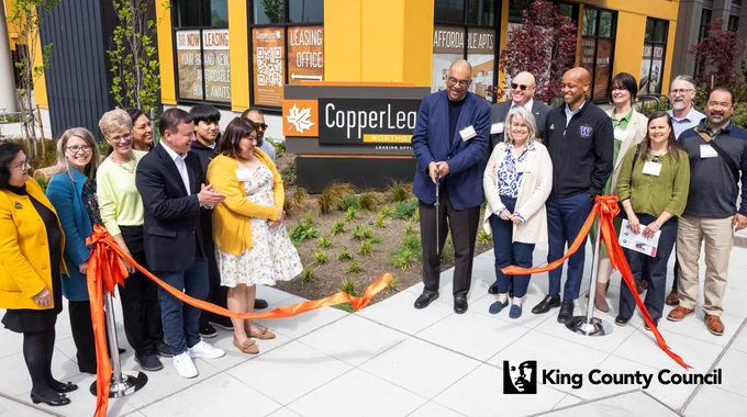 King County Councilmember Rod Dembowski with Executive Zahilay and others, at the ribbon cutting in front of the CopperLeaf Northgate building.