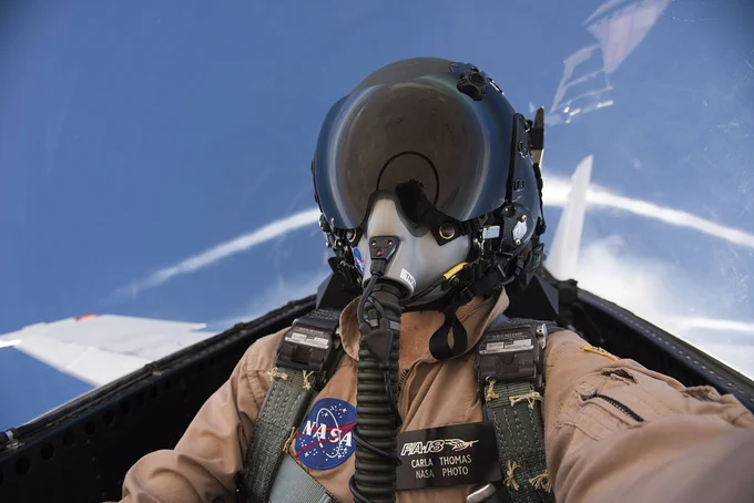 NASA aerial photographer Carla Thomas captures a self-portrait in 2017 during the Sonic Booms in Atmospheric Turbulence program, while flying in an F/A-18 in 2017. Credit: NASA/Carla Thomas