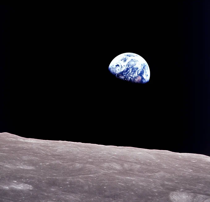 View of the Earth as seen by the Apollo 8 crew orbiting the Moon on December 24, 1968. This photo was later dubbed \"Earthrise.\" Credit: NASA/Bill Anders