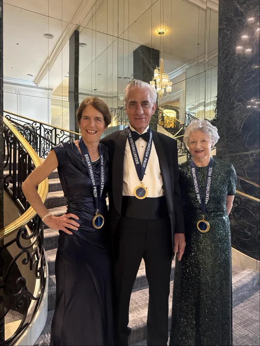 Jean Bennett, MD, PhD, Albert Maguire, MD, and Katherine High, MD, smiling and wearing their Breakthrough Prize medals around their necks