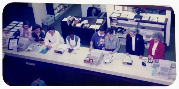From the Columbus-Lowndes Public Library System Collection. Librarians at Circulation Desk at Columbus downtown branch of the Columbus-Lowndes Public Library System; circa 1990s.