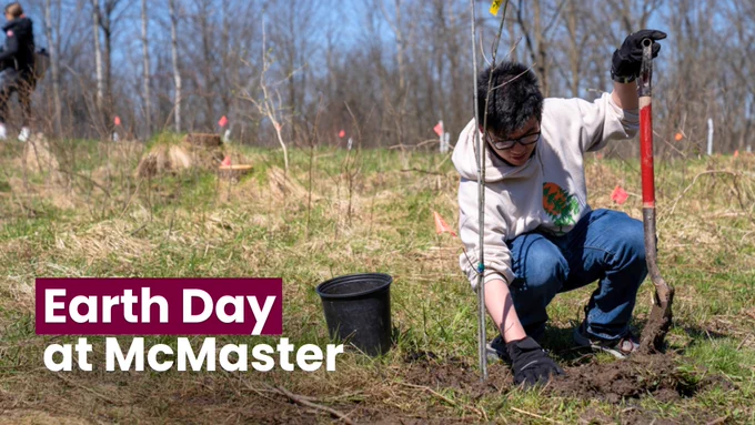 A person planting a tree. There is text on the photo that reads, 'Earth Day at McMaster.'