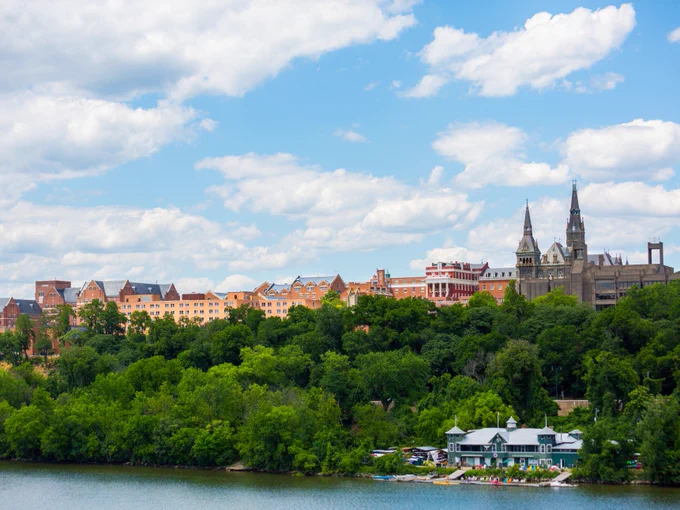 a view of the Hilltop in summer from key bridge
