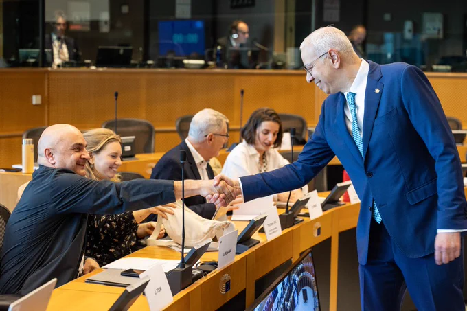 MEP Gordan Bosanac shakes hands with the deputy ambassador of the Cyprus presidency.