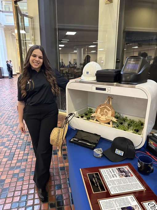 Taaliyah Wright in front of her aquaponics display.