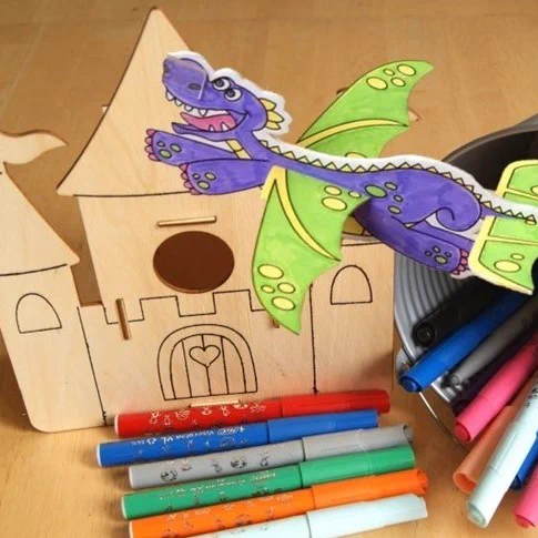 A wooden castle bird house for children's crafts.