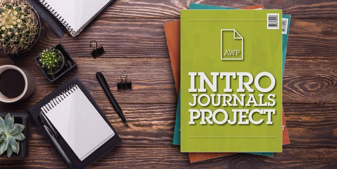 Bird's-eye view of a desk with stack of journals that say AWP Intro Journals Project