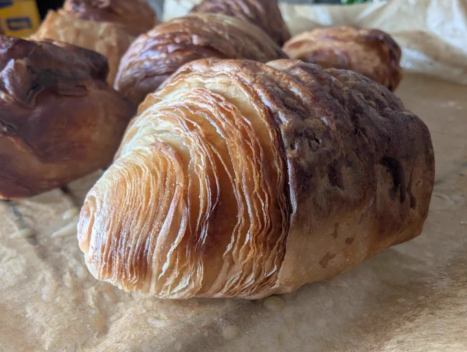 A picture of a home-made croissant, which you can enjoy as a speaker at the open-source meetup