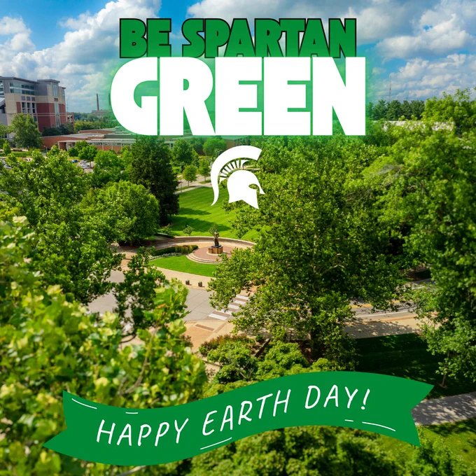 A lush green campus landscape of Michigan State University is seen from above, with trees and walkways. The text "Be Spartan Green" and "Happy Earth Day" overlays the image, along with the Michigan State Spartan helmet logo.