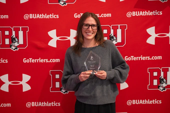 Audrey Ericksen with her team award