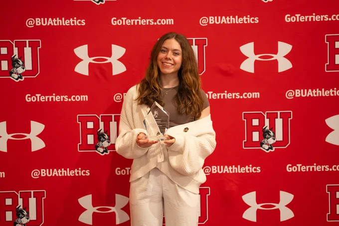 Bella McLaughlin with her team award