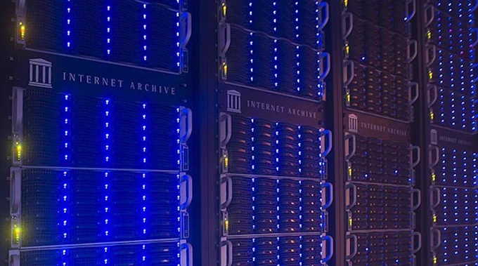 Server racks with blue "blinkenlights" at the Internet Archive.