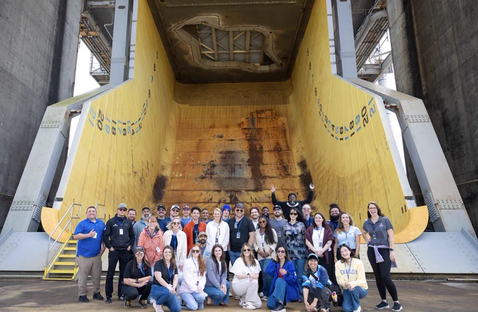 The NASA Social group poses for a photo at the bottom of the flame trench at the Fred Haise Test Stand. Credit: NASA Stennis