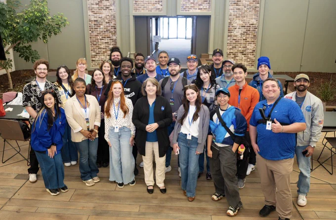 The NASA Social group poses for a photo with NASA Stennis Acting Center Director Christine Powell. Credit: NASA Stennis