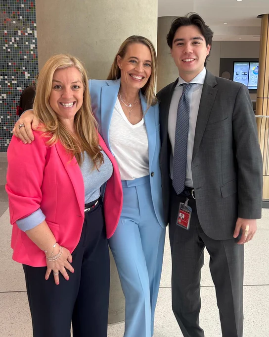 From left to right: Senator Ashby, Jeri Ryan and a staff member smile. 