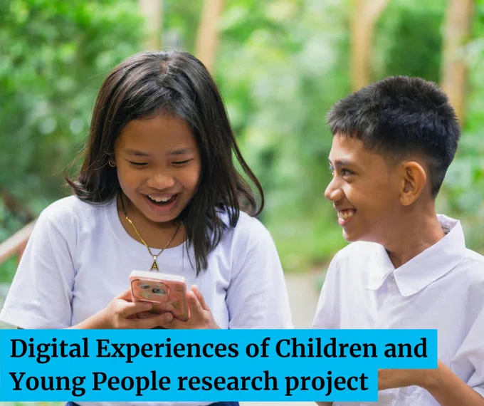 Children on smartphone, laughing. Digital experiences of children and young people research project.