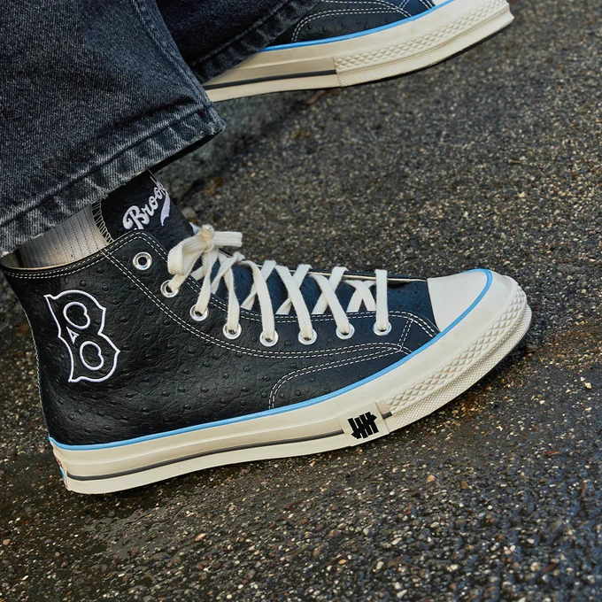 A photo of the new Brooklyn Dodgers version of the UNDEFEATED Chuck 70. The shoe features the Brooklyn Dodgers B on the side with "Brooklyn" written across the tongue.