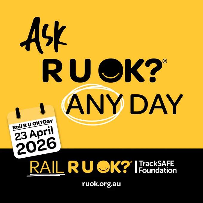 A graphic promoting "Ask R U OK? Any Day" with a yellow background. It includes a calendar page showing "Rail R U OK? Day, 23 April 2026." The logos for R U OK? and TrackSAFE Foundation are at the bottom, along with the website ruok.org.au.