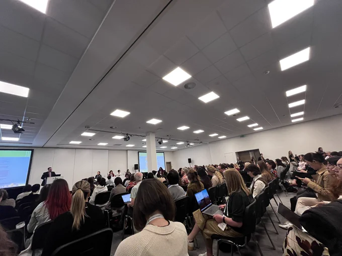 Dr. Steven Kapp speaks to a room of autism researchers at INSAR 2026.