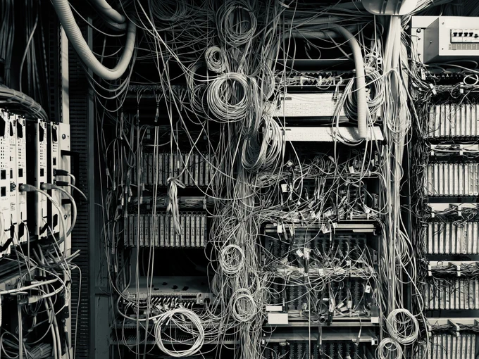 Photo of cables in a room, placed in a very confusing way.