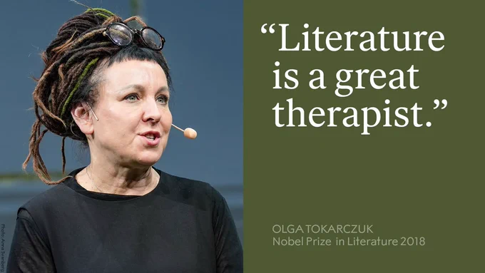 Olga Tokarczuk, Nobel Prize in Literature 2018 winner, giving a speech with a microphone headset, captioned with the quote "Literature is a great therapist.