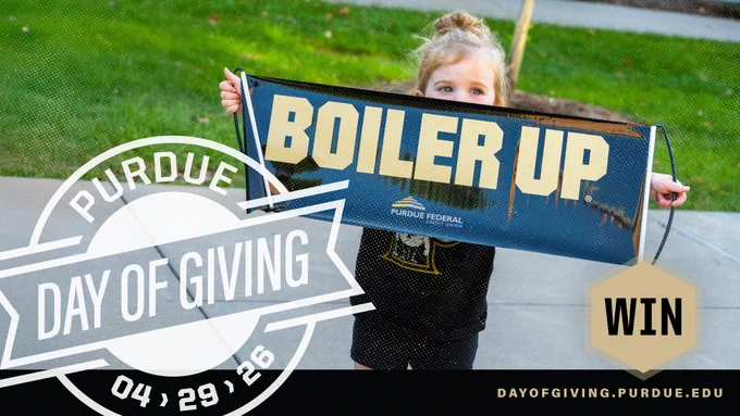 A child holds a “Boiler Up” banner with the Purdue Federal Credit Union logo. The image promotes the “Purdue Day of Giving” on April 29, 2026, with a “WIN” button and website link.