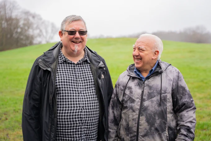 Two gentleman in a field