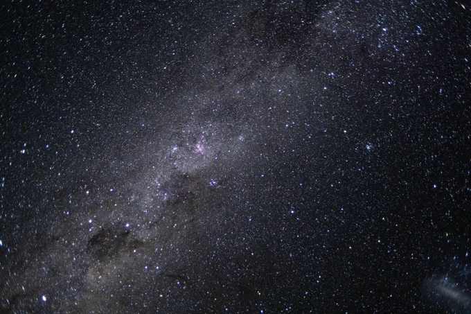 The Artemis II crew captured this photo of our galaxy, the Milky Way, on April 7, 2026. The Milky Way’s elegant spiral structure is dominated by just two arms wrapping off the ends of a central bar of stars. Spanning more than 100,000 light-years, Earth is located along one of the galaxy’s spiral arms, about halfway from the center. Credit: NASA