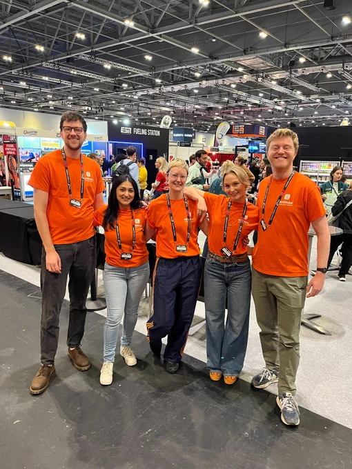 Team Enthuse pictured at the london marathon running show in their orange t shirts