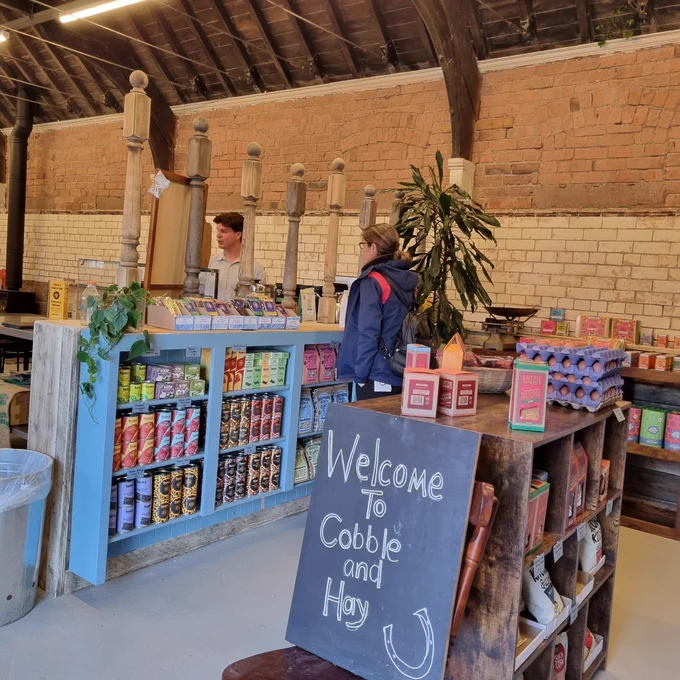 Area with coffee, tea, biscuits, chocolate,  beans and more for sale.