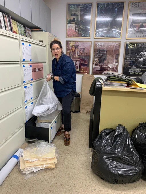 Paperwork to be shredded is put in a clear file and returned to the drawer where it was found. 