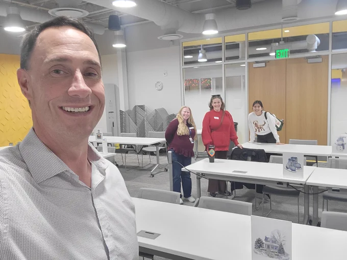 Man taking a selfie with an audience 