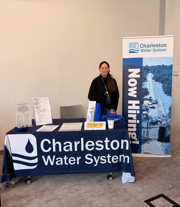 Woman standing at an information booth