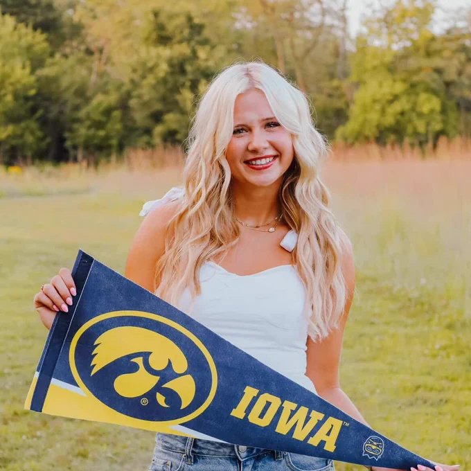 Student with an Iowa pennant.