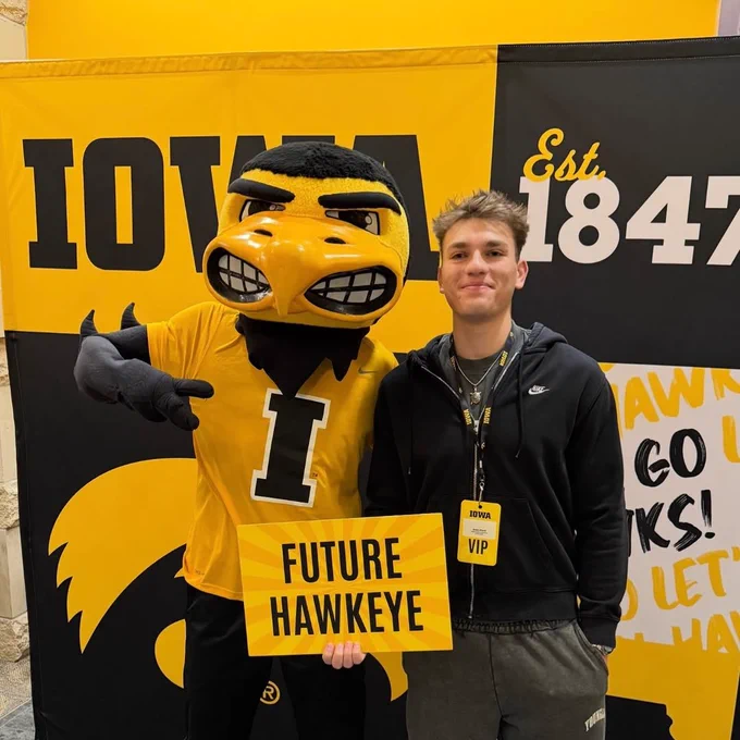 Student with herky and a "Future Hawkeye" sign.
