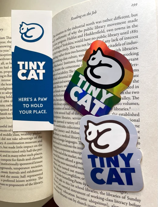 TinyCat bookmark and stickers inside an open book