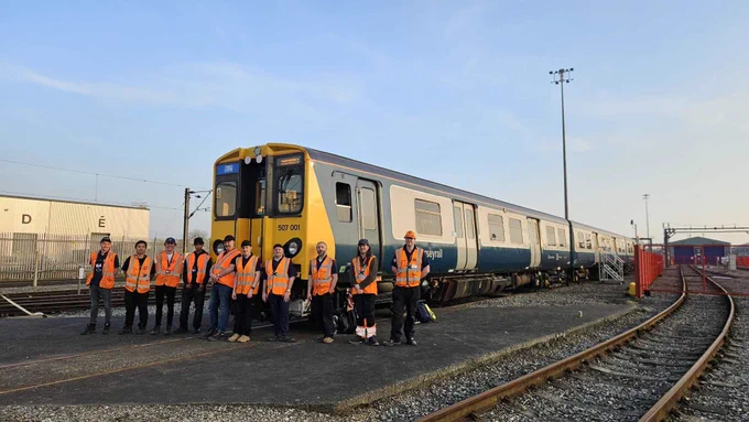 C507PS members pose in front of 507001