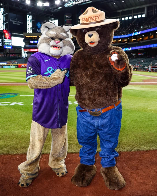 Baxter and Smokey Bear pose for a photo after Smokey Bear threw today's ceremonial first pitch.