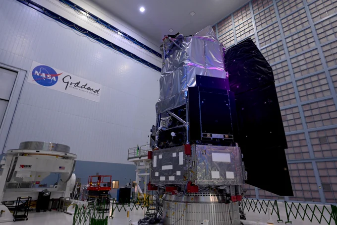 Image shows the inside of a facility at NASA's Goddard Space Flight Center. Inside the building at NASA's Nancy Grace Roman Space Telescope in silver and black protective coating on a work stand. Photo credit: NASA