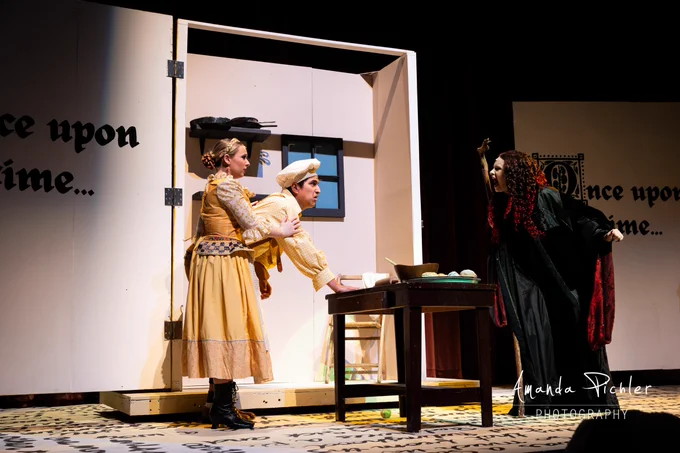 The Witch argues with the Baker and the Baker's Wife in the bakery in "Into the Woods."