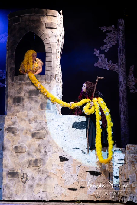 In a high turret, Rapunzel lets down long, yellow hair to the Witch in "Into the Woods."