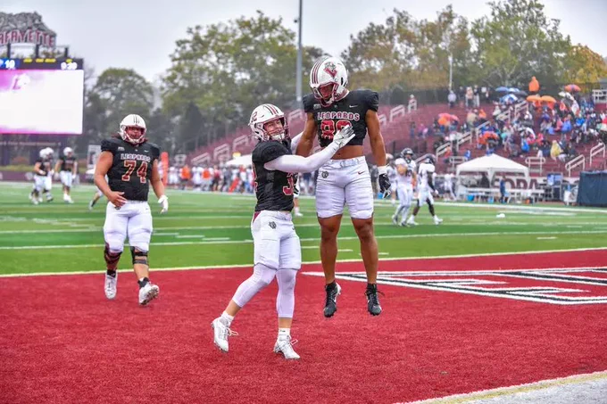 Football players celebrate a touchdown.