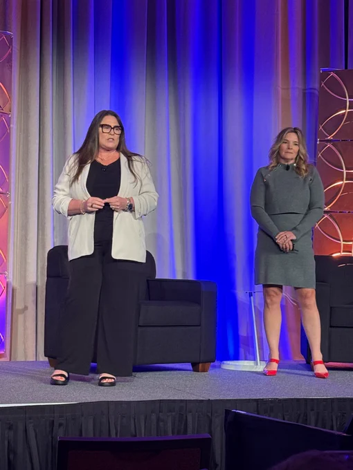 CoSN Board Chair-Elect Kelly May-Vollmar and Board Chair Stacy Hawthorne preside over the second General Session at CoSN2026