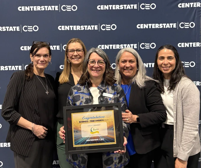 Stephanie Finn, Anne Marie Smith, Dr. Maria Murray, Dr. Marisa Ramirez Stukey, and Soledad Calvino pose together at Centerstate CEO's Annual Meeting with The Reading League's plaque recognizing the organization as a Nonprofit of the Year Award finalist for 2026.