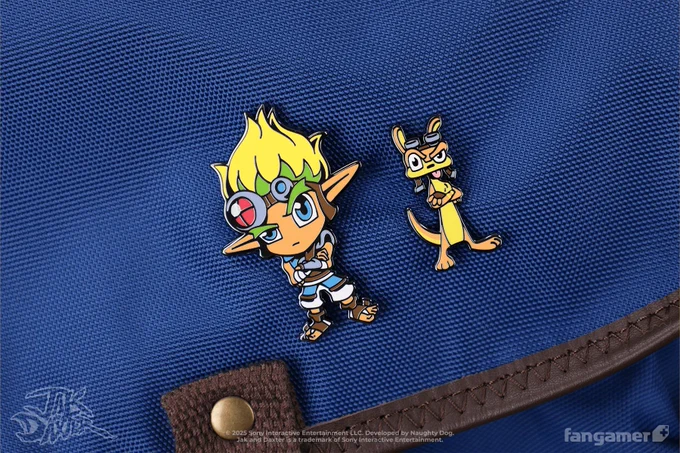 A photo of the Jak and Daxter enamel pin set. Each character has his arm folded with one eyebrow raised. 