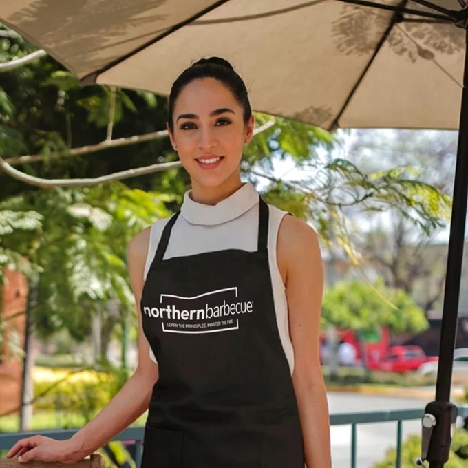 Barbecue woman in a Northern Barbecue apron.