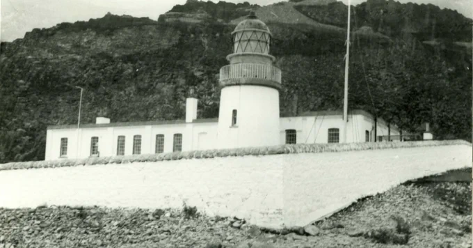 A black and white photgraph of a lighthouse.